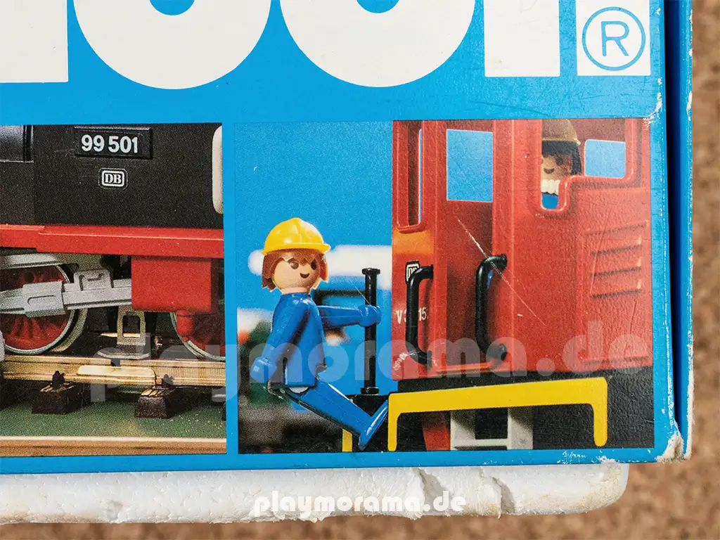 Rangierer hält sich an Peilstange der roten Playmobil Diesellok fest.